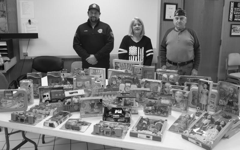 The Columbus VFW Auxiliary donated toys to the Columbus Fire Department Shop with a fireman campaign. Firefighter Juston Grafel accepted the toys for the Columbus Fire Department. Peggy Britt president of the VFW Auxiliary gave the toys to the Fire Department because they were no longer have their kids Christmas Party. Jim Oberbeck Commander of the Columbus VFW Post attended the exchange.