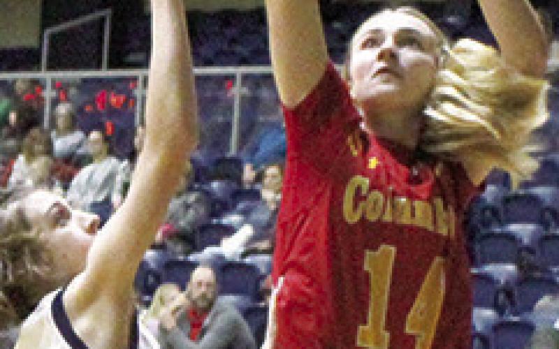 Lady Titan Senior, Maddie Buergin, shoots for two points over her Galena opponent, Tuesday night. The Lady Bulldogs earned a 47-39 win over their guests in the CNC League contest in Galena.
