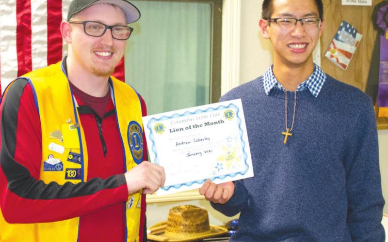 President of the Columbus Lions Club presented Andrew Coberley with his certificate naming him Lion of the Month for January. Coberley is a senior at Columbus Unified High School