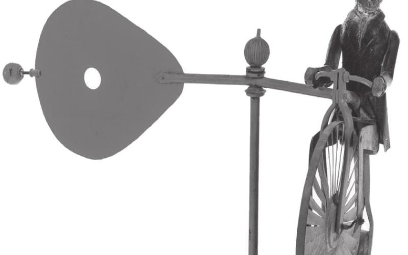 This folk art whirligig shows President Theodore Roosevelt with his monocle and top hat riding a cycle while holding a red paddle that catches the wind and spins. It sold at auction for hundreds of dollars.