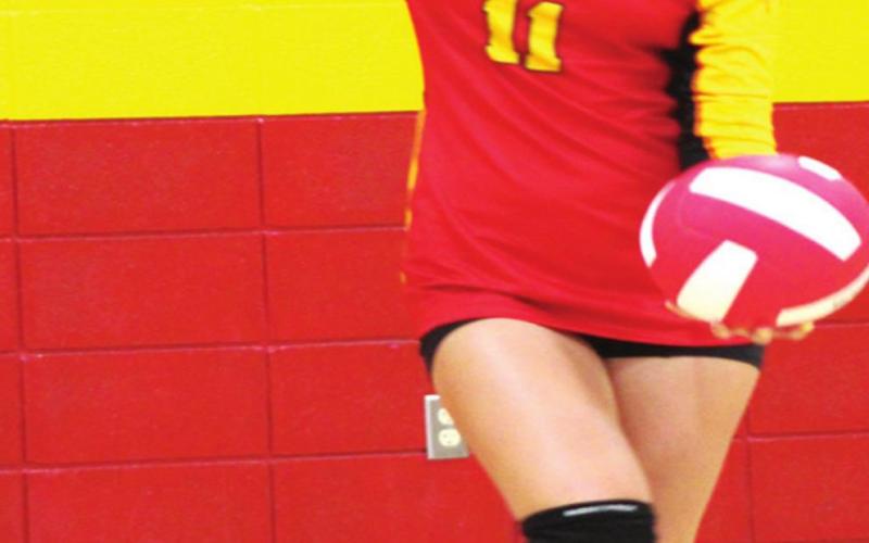 Freshman Ruby Stover prepares her serve during the traditional, Lady Titan Volleyball inter-squad scrimmage prior to the Titan Booster Club’s Meet the Titans, August 24 at the CUHS Gym. The Junior Varsity opened their season Monday in Coffeyville with wins over the Lady Golden Tornados and Independence in the triangular tournament.