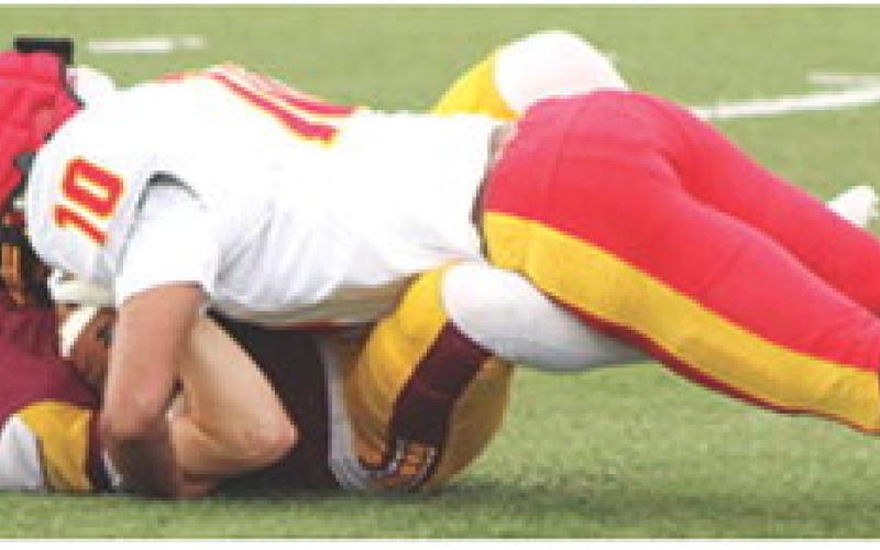 Titan Sophomore, Ja’Kai Langerot, takes down the Girard ball carrier during the junior varsity reps at the four-team Jamboree scrimmage in Girard, Friday. Sophomores are the largest class on the Titan Squad this season with 12.