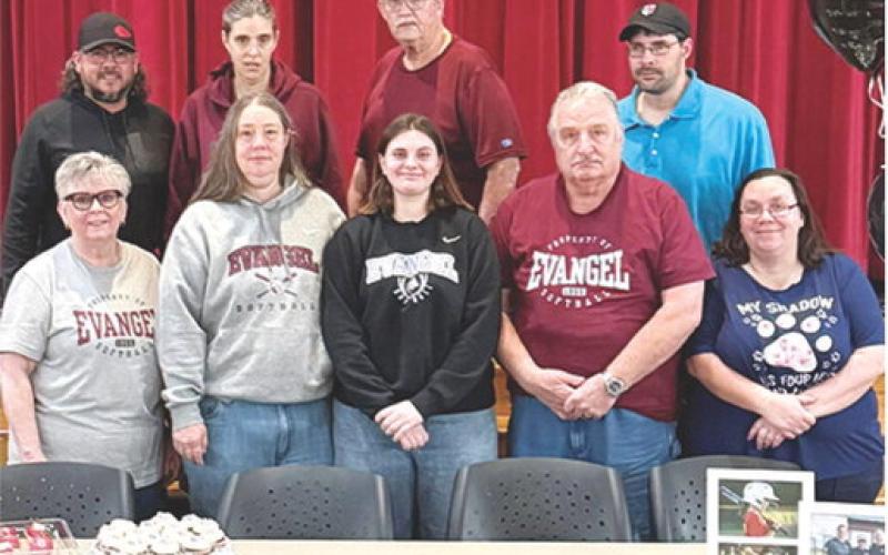 Lady Lion Emily Schoon signed a National Letter of Intent to extend her softball career at Evangel Univer- sity next fall.