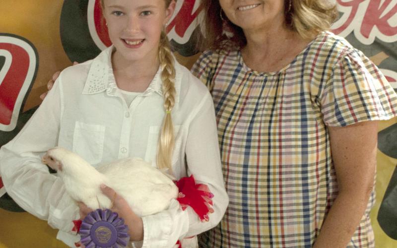 Some 4-H members opt to sell their animals during the premium auction at the Fair. Money received in the premium sale allows them to continue to grow and learn into the next year’s fair, with purchasing their next project animal.