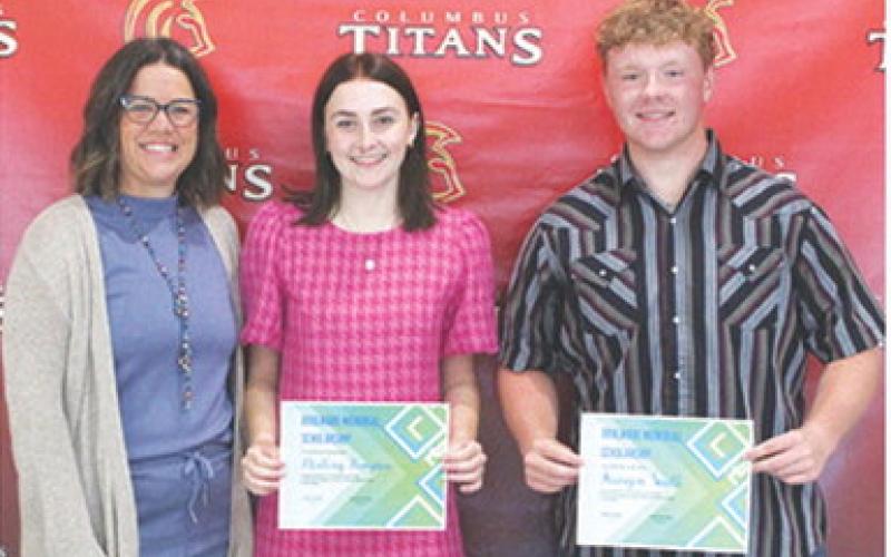 Mallory Thompson and Kanyen Smith received the Boulware Family Scholarship in the amount of $1,050 each from USD 493 Instructor, Kelly Walters during the 2025 Senior Assembly, May 16, at the Columbus Unified High School Gymnasium.
