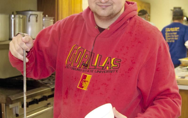 Columbus Lions Club members were busy at the annual bean feed. Nate Jameson was dipping beans for hungry customers. The event is popular with those in the area.