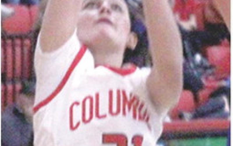 Sophomore, Americus Woodcock, shoots for two in a recent home game vs. Colgan. Friday in Riveton, Americus led the Lady Titan Junior Varsity to a 3027 win over the Lady Rams.