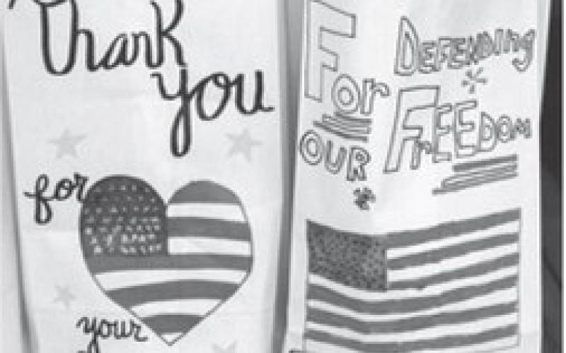 Last year local students decorated the sacks used to pack the lunches for veterans and first responders. This year the event will be a drive through event at the Lions Shack.