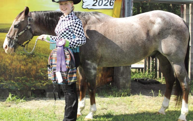 During annual Cherokee County Horse Show Violet Huddleston was presented the award for both Grand Senior Showmanship and Grand Gelding.