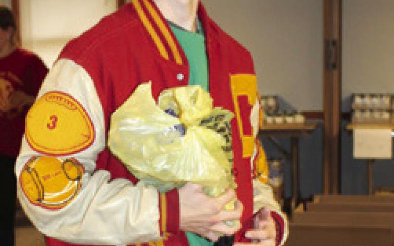 Columbus LEO Club helps assemble Thanksgiving food boxes