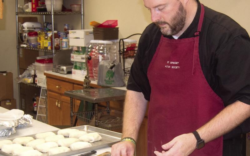 St. Bridget’s Catholic Church held their annual Oktoberfest dinner on Sunday with a special treat from Father Chris Martin as he prepared the bierocks filling using his grandmother’s recipe.