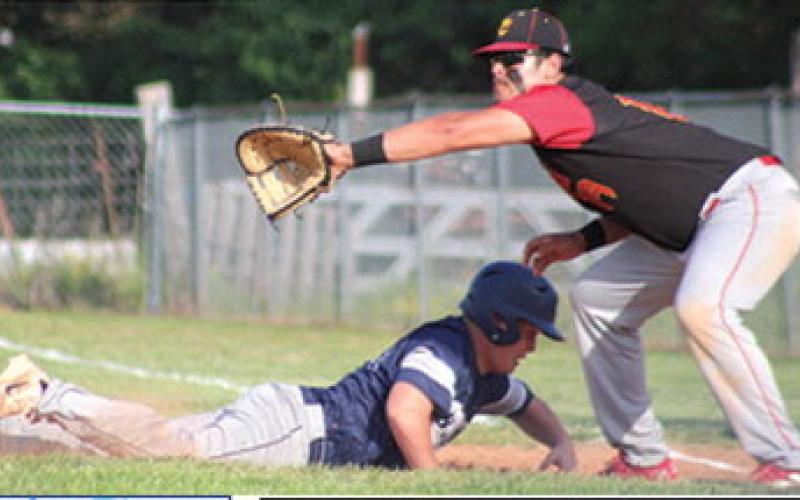 Right: Titan Senior, Rece Ponce, helps hold the Galena runner at first during the Kansas Class 3A Regional shut out, 6-0, Wednesday, at the Community Field Ballparks, Bomber Field. Rece had two singles, a double, two Runs-Batted-In and two runs scored in the win. Columbus will play Caney Valley today at 2 p.m. in the semi-final at Riverton.
