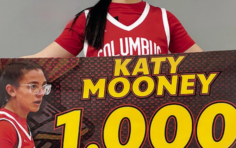 Columbus Lady Titan Senior, Katy Mooney, reached 1,000 career points in the win at Baxter Springs, Monday. Katy needed ten points going in to the game and picked up the record breaker at the end of the first half. She tallied 20 points for the game.