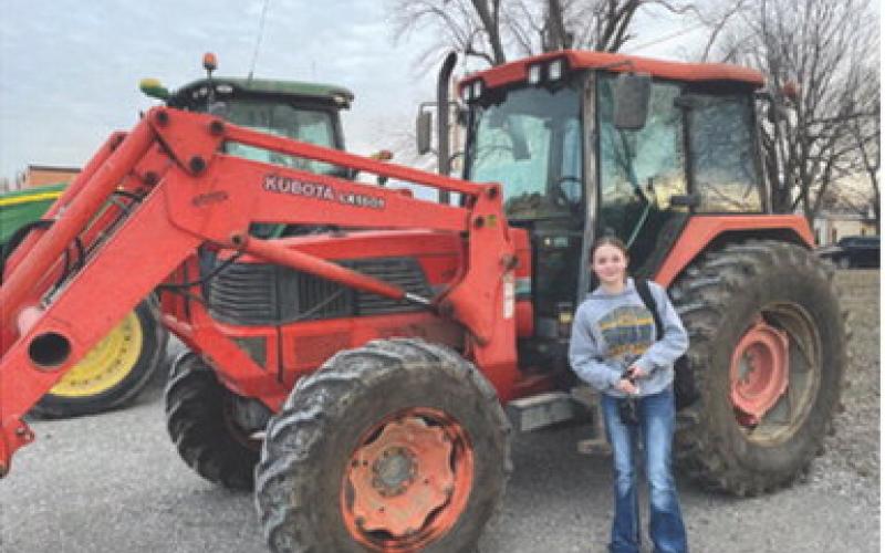 Grace Eshelman was one of the Columbus High School Future Farmers of America members who drove her tractor to school as part of FFA Week at CUHS. Due to the weather, the breakfast they had scheduled has been reset to Wednesday, February 26 from 7 a.m.-9 a.m. in the Ag room. Courtesy photo.
