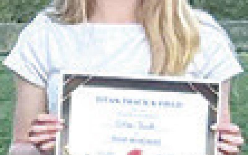 Titan first year head coach, Rachel Bycroft, presented the Columbus Unified High School Track and Field Team with awards at the end of her first regular season during a backyard banquet in May. Piper Hayes, senior; Cooper Reid, freshman; Cole Howard, sophomore; Steven Phillips, freshman; Levi Simpson, junior; Jace Gaither, freshman; and Graci Zook, freshman were present to received their award certificates. Courtesy photo.