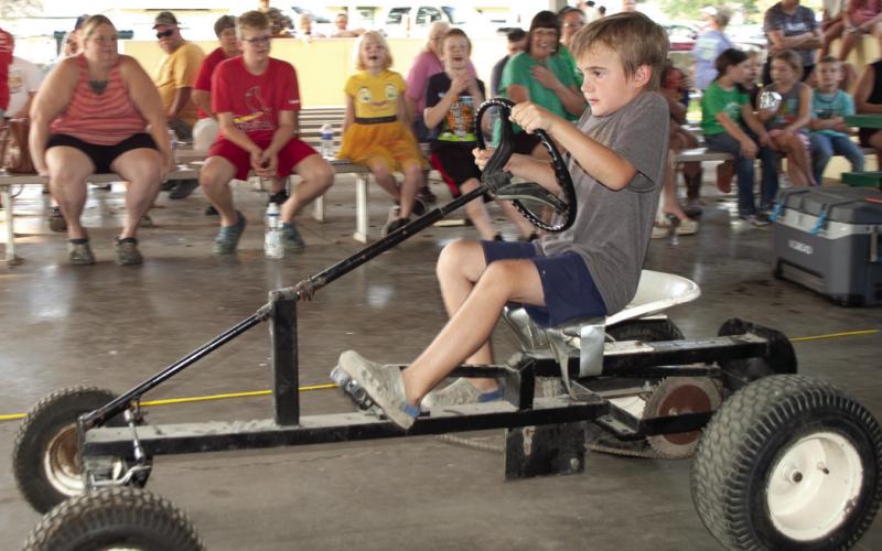 Tractors used in the pedal tractor pull vary depending on the age of the entrant. Older children get to try their hand at this tractor. Winners in each division have the opportunity to compete at the Kansas State Fair.