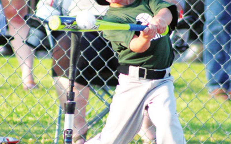 Baylor Bowman makes good contact for a big hit in Columbus Cal Ripken T-Ball action at the Community Field Ball Park.