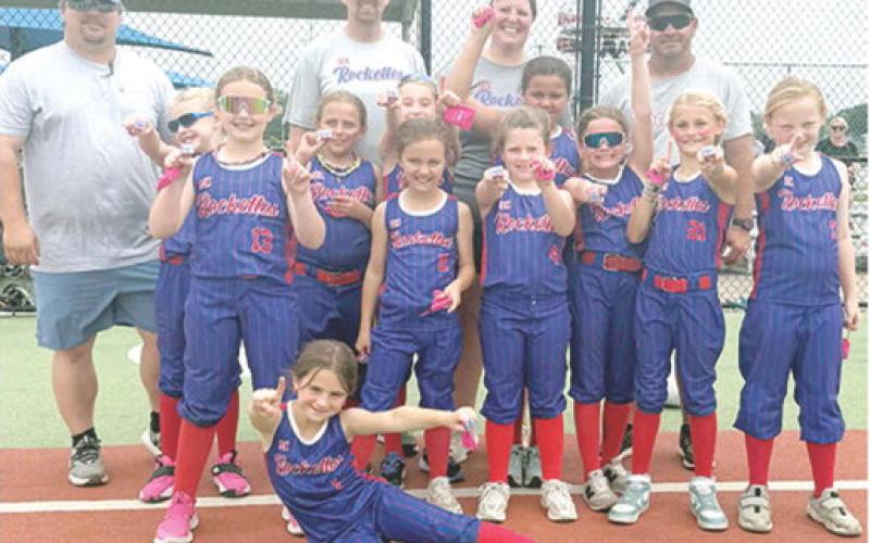 The Columbus 8U Rockettes won the Memorial Maynia Softball Tournament in Joplin, Mo. Friday and Saturday. The won two with no losses in pool play before winning the championship, 11-3. Team members are Emerson Carter, front; middle row: Amyx Evans, Morgan Moser, Oakleigh Mays, Kynlea Littlejohn, Aniah Palmer, Taylynn Midgett, Renley Knopp, and Jasmine Wininger; and back row: coaches, Jeremy Gulick, Lance Moser, Anna Moser and Bryan Midgett. Courtesy photo.