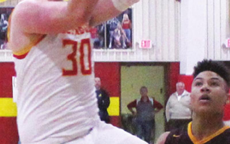 Titans fall in clash with Trojans