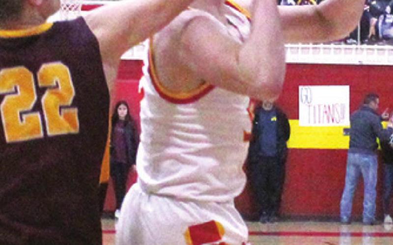 Titans fall in clash with Trojans
