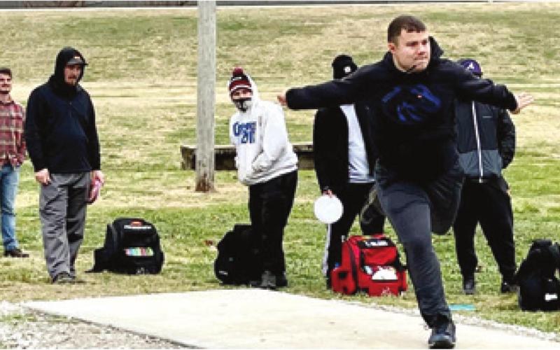 Gabe Shelton was first up to throw during the Run for the Roses. It takes power, determination and technique to throw a disc accurately. Photo by Dee Riley.