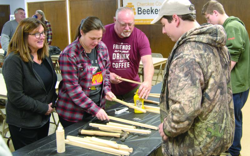 Everyone was busy as bees during the Cherokee County area Beekeepers club meeting as they were building frames to put in the hive box which was given away.