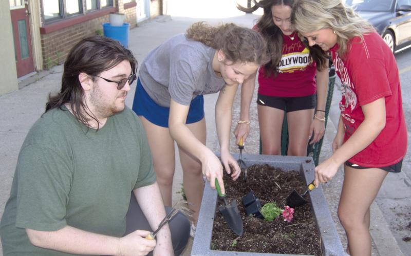 Members of Columbus High School National Honor Society filled area planters with flowers before the end of the school year. Those helping included Robert Graham III, Ruby Stover, Faith Williams and Kenadie Carter.