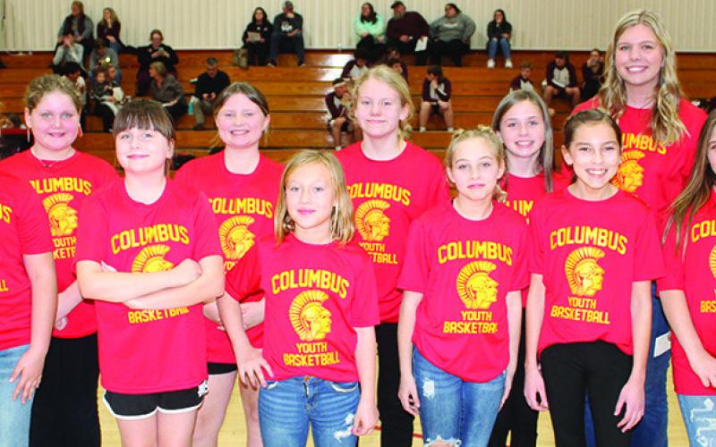 The Lady Titan Fifth Grade Columbus Rec Team was introduced during the Varsity halftime of the Lady Titans game against St. Paul. Team members are back row: Alivia Perdue, Gracie Stanley, Lydia Wilkins, Sammi Ohmart, and Coach Karsyn Youngblood. Front row: Piper Cain, Grace Alderman, Lexie Webb, Zoe Hale, Kiptyn Saporito, and Iyionna Basauri.