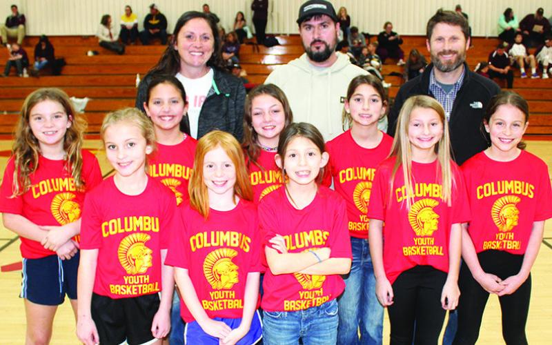 (Right) The Lady Titan Fourth Grade Columbus Rec Team was introduced during the Varsity halftime of the Lady Titans game against St. Paul in January. Team members are back row: Lindy Smiley, Morgan Anderson, Tannor Harris, Izzy Crain, Paizley Buergin, and Kinzley Hess. Front row: Cali Rogers, Karrah Croizer, and Angelina Capron. Coaches for the team are: Devon Anderson, Bryce Buergin, and Dan Walters