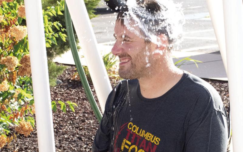 One of many games for students to participate in at the annual Back-To-School Carnival hosted by Columbus USD 493 Thursday, August 27 was the ‘Dunk Tank’ sponsored by Coffeyville Community College. Park Elementary Principal Matthew Crain was all smiles just before this torrent of water cascaded onto his head.