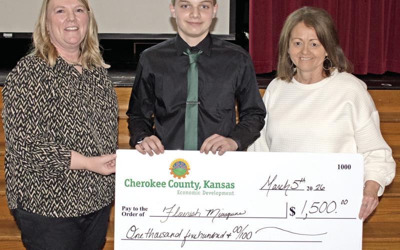 A microgreens company called Flourish Microgreens founded by Jacob Busse from Baxter Springs High School was the top winner at the Youth Entrepreneurship Fair held Thursday, March 5. Holly Johnson and Donna Westervelt presented Busse with his $1,500 check.