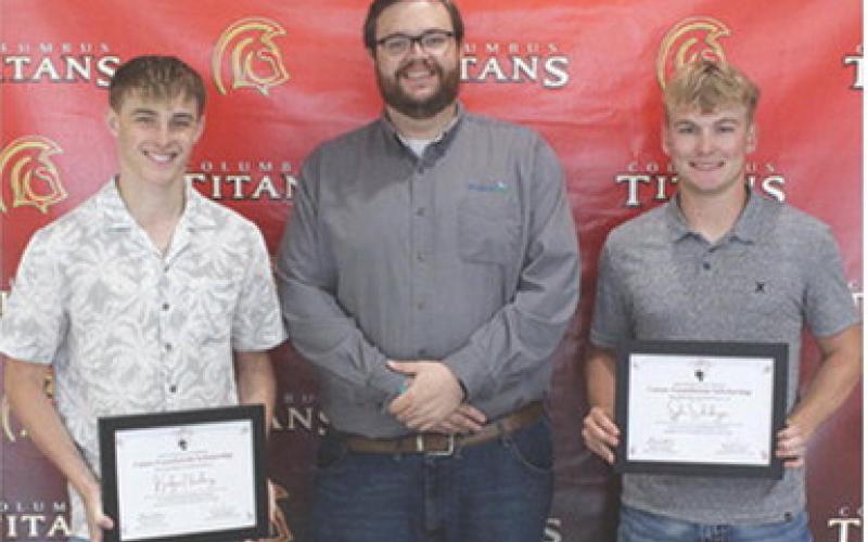 Korbyn Newberry and Syler Schuberger were the recipients of the Heartland Scholarships in the amount of $1,000 each from Heartland Representative, Doug Graham at the Senior Assembly, May 16, in the CUHS Gymnasium.