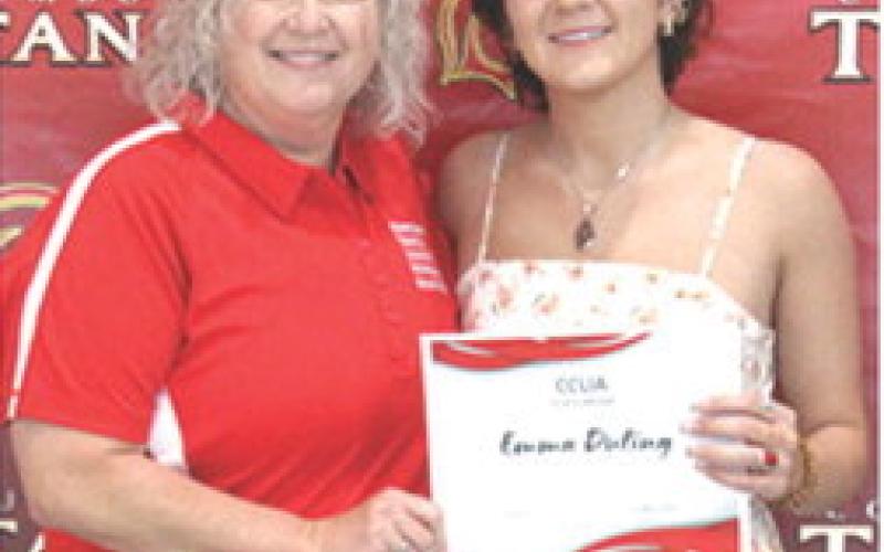 Emma Duling received a $250, Sammie Ross, CCLIA Scholarship from CCLIA Representative, Rhonda Herrenbruck, during the May 16, 2025 Senior Assembly at the CUHS Gymnasium.