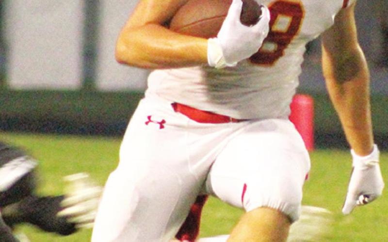 Titan Junior All-Conference Linebacker, Kick Returner, and Wide Receiver, Landin Midgett, was lost for the season in the Titans second series of their first game, Saturday morning in Frontenac. Landin will have surgery on his right tibia to repair the damage and will be sidelined for the entirety of the Titans 2021 schedule. Above, Landin runs back a punt return for the Titans first possession of the year.