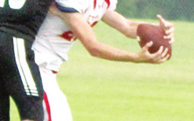 Titan Junior, Cole Minor, makes the catch inside the five-yard line despite the efforts of Frontenac Senior, Parker Beckmann in the 0-20 Columbus loss to the Raiders, Saturday in Frontenac.