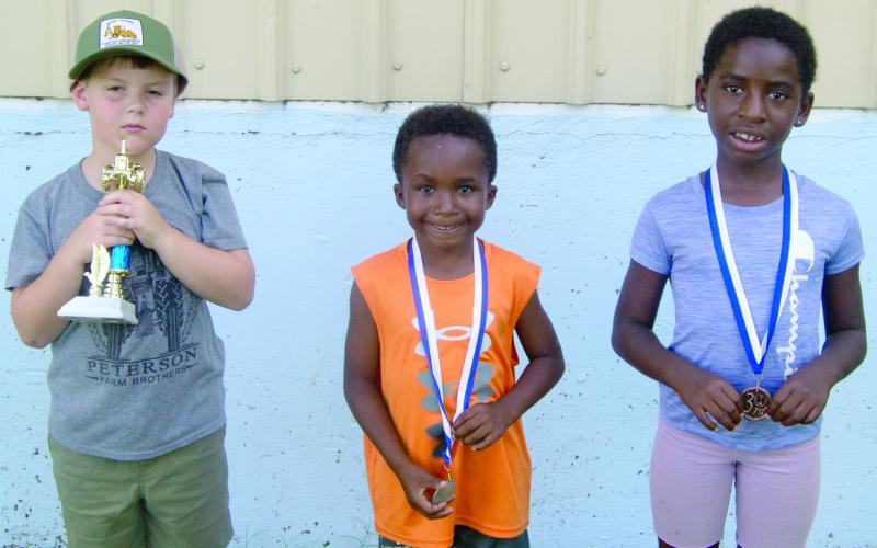 In a very close 6-year old pedal pull, only two inches separated the top pullers. The first place went to Jace Evans with a 35-foot 8-inch pull and Miles Reeves pulled 35-foot 6 inches. Third place went to Lyiah Lacen.
