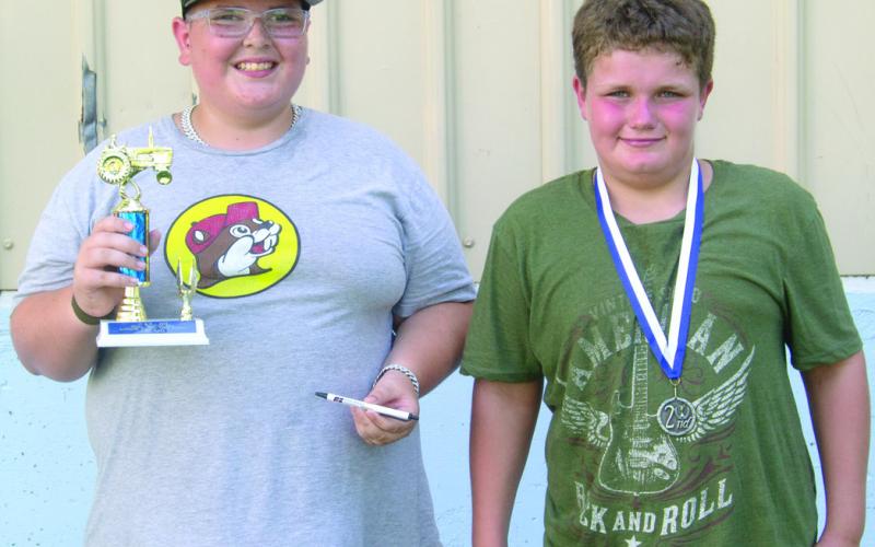 The competition was so close in the 11-year-old division they both pulled the length of the course and had to be moved to the sidewalk around the park. Ryker Saporito took first place and Kayden Fleshman was second.