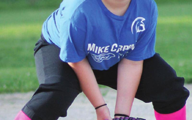 Evelyn Smith is “down and ready” for some action during the Mike Carpino 8U games at the ball park recently. The girls diamonds fell silent following the league tournaments at the end of May. The boys fields will be full of action with the 8U State Cal Ripken Tournament, tomorrow, before closing for the season.