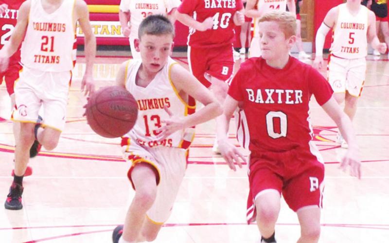 Titan Seventh Grader, Carter Woodcock, gets a break-away drive during the Central Titan 7A loss to Baxter Springs, January 6 at the Central Gym. Logan Abbott defends for the Lions. Drake Laurance, Brody Matson, Kooper Saiz, and Ethan Midgett trail for the Titans. Brooks Walker is in the mix for the Lions.