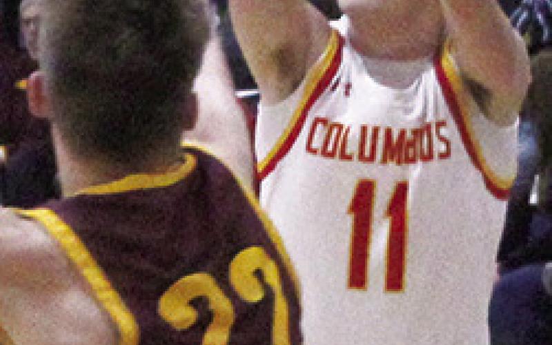 Titan Senior, Mack Kirk, shoots over Girard Senior, Tommy McDowell, in the 49-37, Titan win over the Trojans, Tuesday, in Columbus.