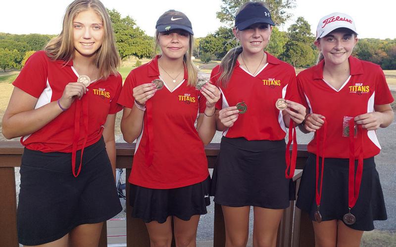 The Columbus Lady Titan Golf Team completed their 2022 regular season at the Baxter Springs CNC Invitational Tournament, Tuesday, at the Baxter Springs Country Club Golf Course. The Lady Titan Team placed third in team standings and sophomore, Mallory Thompson, taking fifth in individual placings. Displaying their hardware are: sophomore, Anna Head, senior, Kenlyn Christiansen, junior, Reese Grundy, and Thompson. Courtesy Photo.