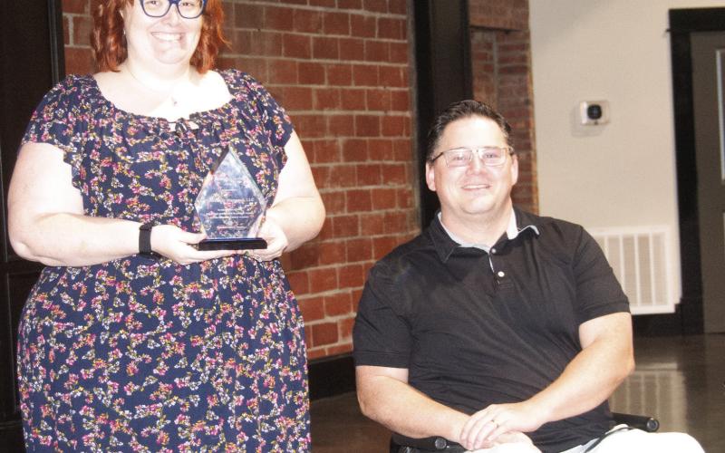 Gracefully Managed LLC owner Sara Comer accepted the Cherokee County Economic Development Corporation’s Business Growth award from board chairman Brian Smith at the organization’s annual breakfast meeting.