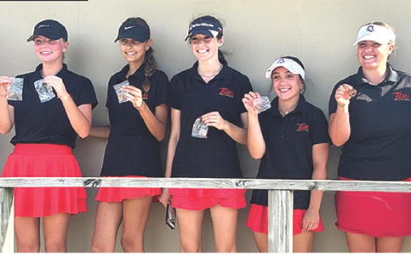 The Lady Titan Golf Team placed third in the Chanute Invitational Golf Tournament, Monday. Freshman, Cali Carpino, earned her first individual title to lead the team in the field of 45 golfers. Team members are Head Coach Jerry Smiley, Cali, Addison Johnson, freshman; Natalie Wary, junior; Hannah Noel, junior; Fallon Smiley, freshman; and Amory Neely, junior. Courtesy photo.