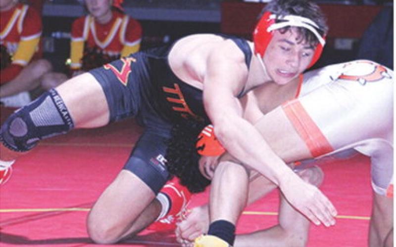 Titan Junior, Jayden Rodriguez, works to pin Kaeson Lewis, Independence, during the home team’s dual win, Tuesday, at the CUHS Gymnasium.
