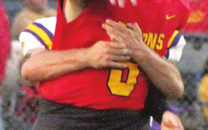 Junior Quarterback, Brett Hamilton, takes all the snaps behind the center while senior, Jaxson Haraughty, recoups from an ankle injury. Brett threw eight completions in 11 tries for 123 yards and three touchdowns against Coffeyville, Friday, in the 40-8, win for Columbus at Titan Stadium.