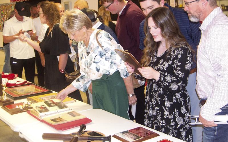 Former athletes and Baxter Springs High School students sorted through the memorabilia from the past. Everyone appeared to find something that they remembered from their high school days. Much of the material was from the personal collection of baseball coach Don Karnes.