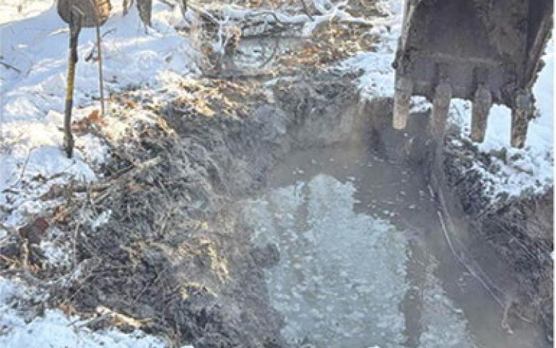 Despite the frigid temperatures, crews with Cherokee County Rural Water District #3 were out repairing a large leak. The leak was located in the area west of Southwest 50th and Highway 166. A three inch line busted in a casing where it goes under the Creek. Crews were able to quickly repair the leak. Courtesy photo.