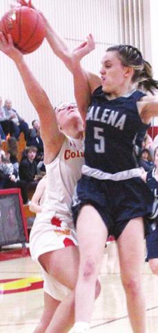 Lady Titan Freshman, Katy Mooney, is fouled by Lady Bulldog Freshman, Rylee Boyes, in the fourth quarter, Tuesday, at the CUHS Gym. Katy made both free throws to keep Columbus in the lead 28- 25. Galena ended up with the win, 38-36.
