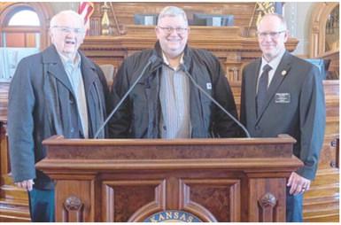 During City Government Day at the Kansas State Legislature, Columbus Council member Tom Pryor and Mayor Grant Spieth visited with State Representative Dale Helwig during a break in the session.