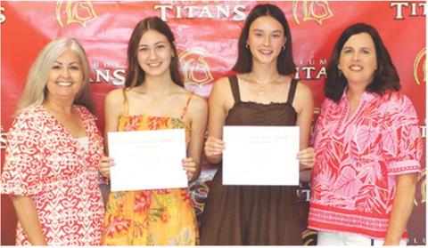 Darcy Garrett and Piper Hayes, seniors, received the Columbus Public Library Scholarship in the amount of $500 each from Shari Napier and Jennifer Thompson, Library Board Members during the Columbus Unified High School Senior Assembly, May 15 at the CUHS Gymnasium.